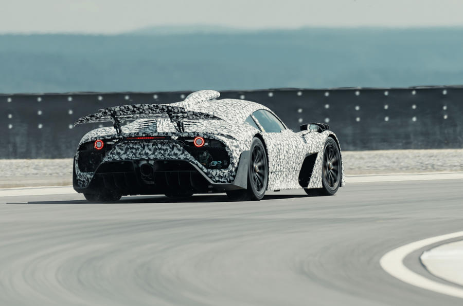aria-label="97 mercedes amg one official camo cornering rear"
