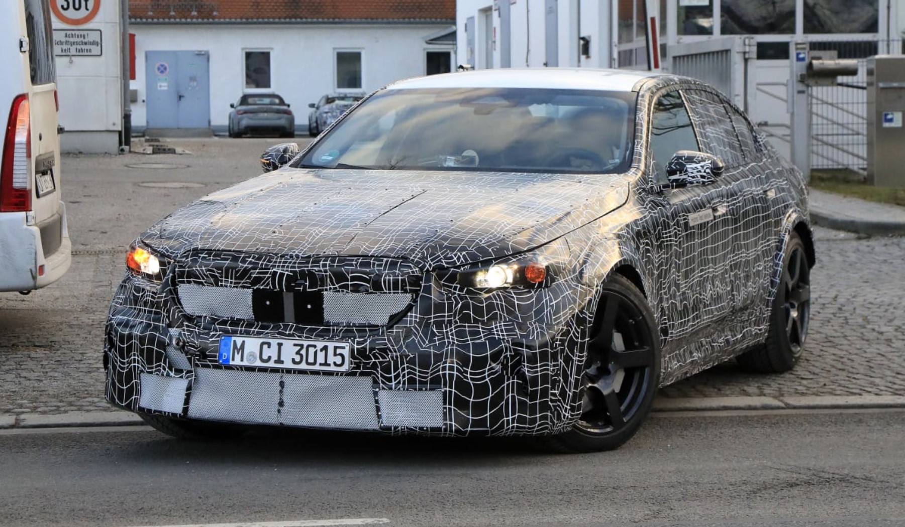 aria-label="2023 BMW M5 spy pics hybrid"