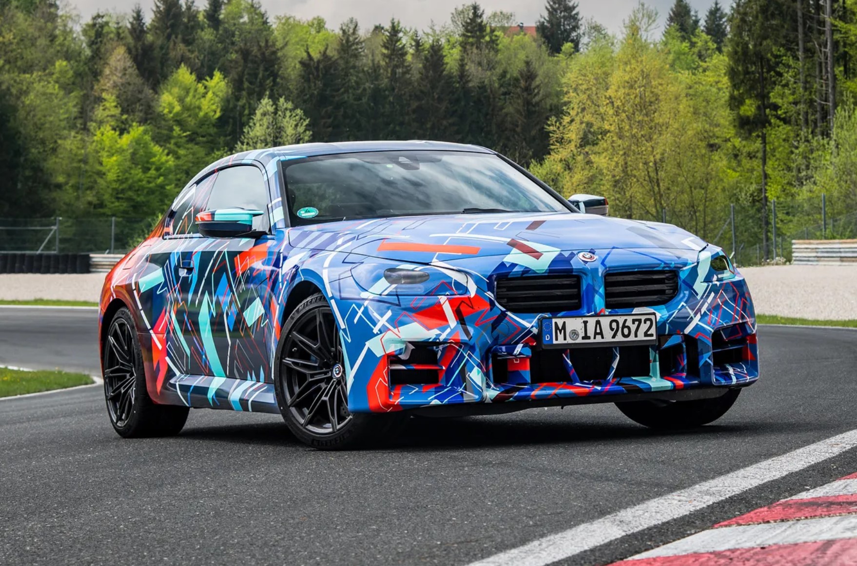 aria-label="2023 BMW M2 revoiew protrotype blue camo 8"