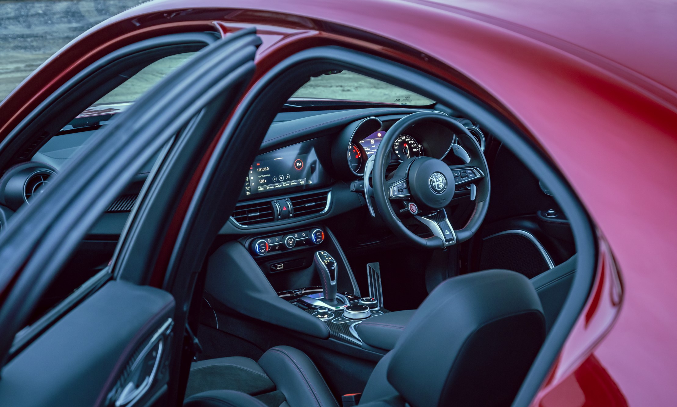 aria-label="Alfa Romeo Stelvio Q red interior front through"