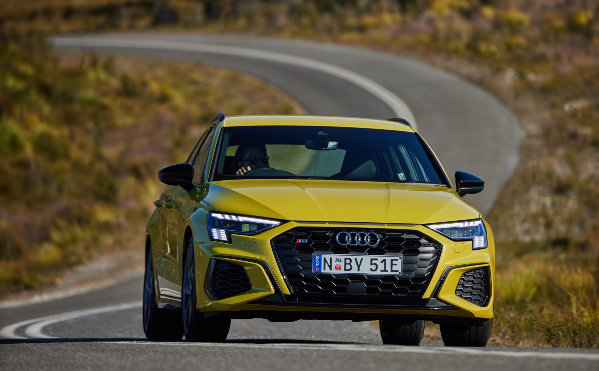 aria-label="Audi S3 yellow driving review 1"