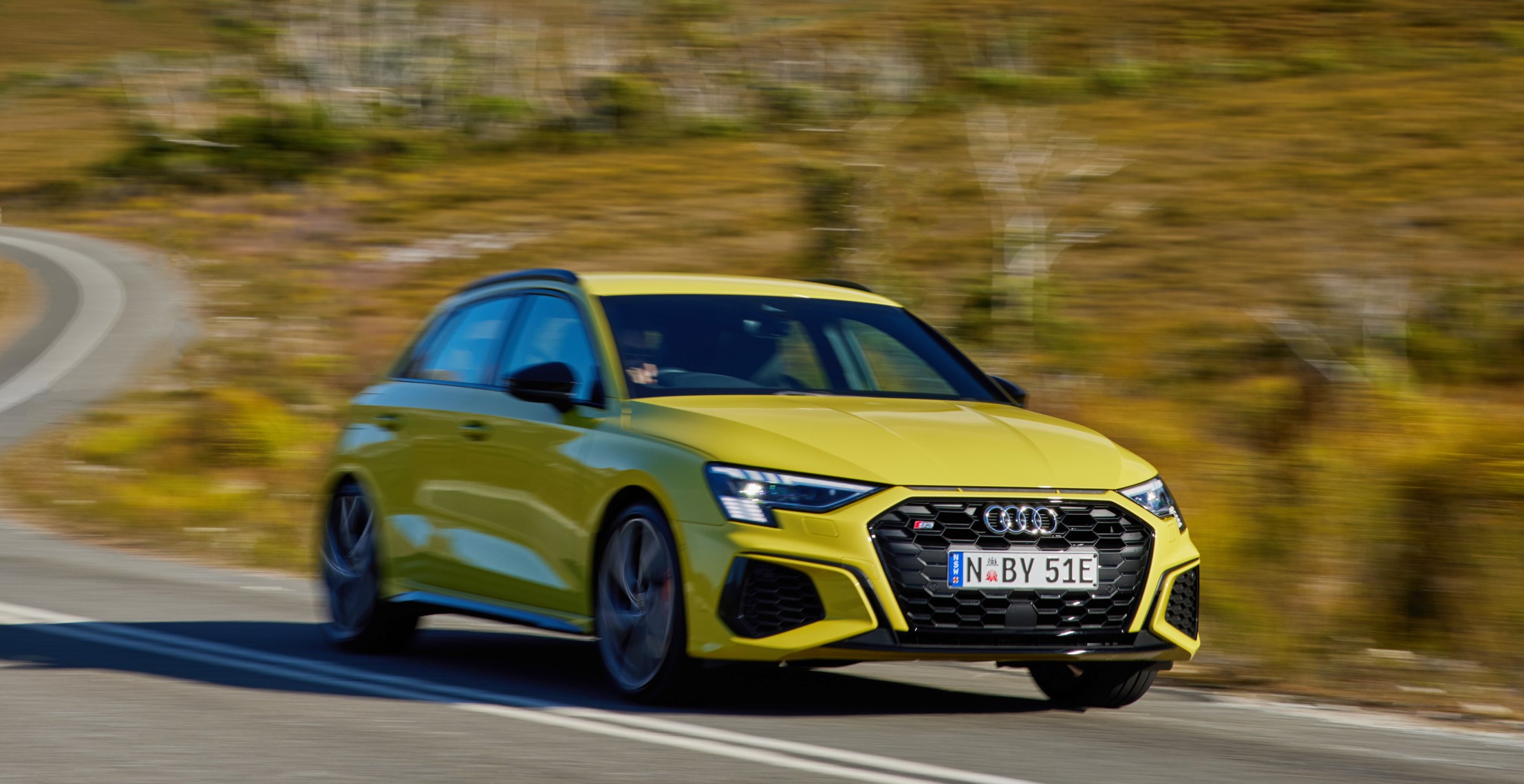 aria-label="Audi S3 yellow driving review 4"