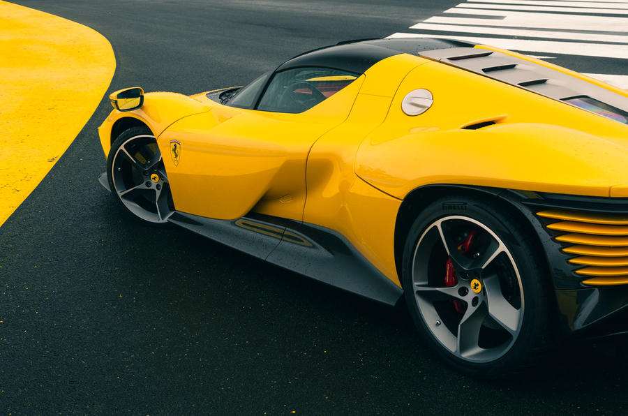 aria-label="Ferrari Daytona SP3 Yellow race track 16"
